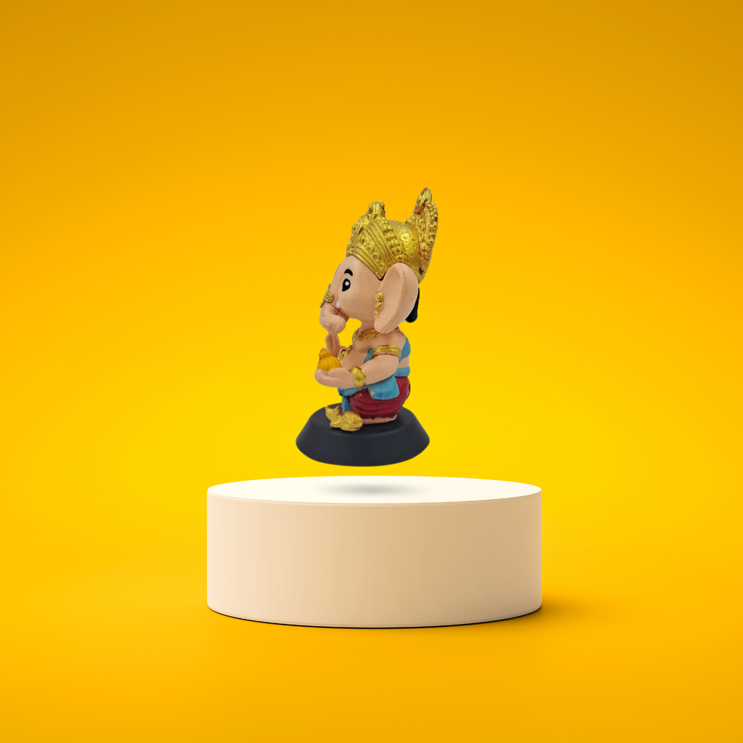 Side view of Lord Ganesha bobblehead figurine