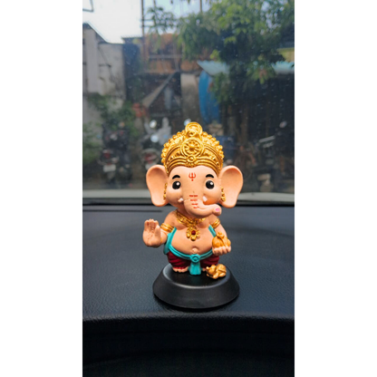 Lord Ganesha bobblehead figurine on desk